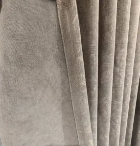 embossed velvet curtain fabric closeup gray
