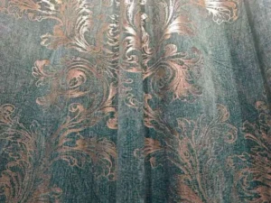 Custom emerald green velvet curtain fabric wholesale featuring luxurious gold embossed damask patterns for hotel projects