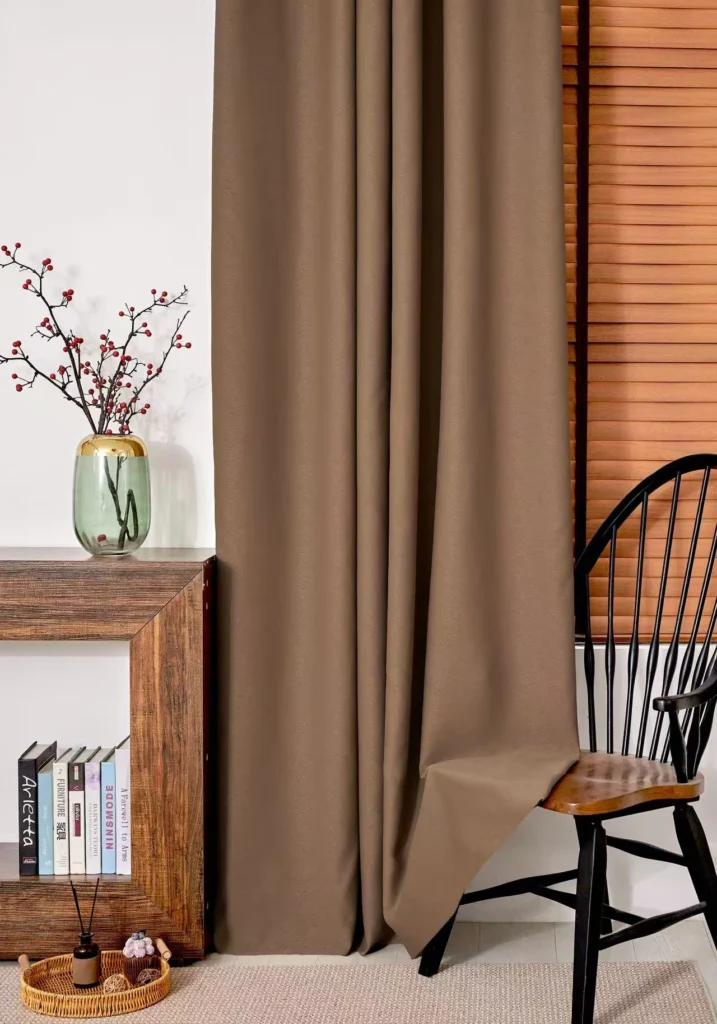 Premium 900Gsm Heavy Duty Brown Curtain Fabric Hanging In A Modern Living Room, Featuring 85% Blackout Performance And Thermal Insulation For Cold Climates.