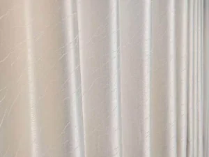 Close up detail of luxury textured curtain fabric from our ready stock inventory, ideal for hotel projects