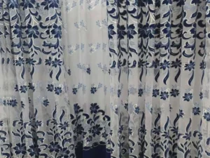 Wholesale blue floral embroidered sheer curtain fabric with elegant drape for luxury hotel projects